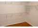Walk-in closet with wire shelving and hardwood floor at 2335 Corbett Ct, Powder Springs, GA 30127