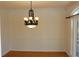 Formal dining room with decorative chandelier and natural light at 2335 Corbett Ct, Powder Springs, GA 30127
