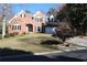 Charming brick two-story home with landscaped front yard and attached two car garage at 2335 Corbett Ct, Powder Springs, GA 30127