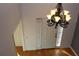 View of foyer with hardwood floors and decorative chandelier at 2335 Corbett Ct, Powder Springs, GA 30127