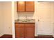 This kitchen features wood cabinets, granite counters, and a stainless steel sink at 2335 Corbett Ct, Powder Springs, GA 30127