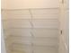 Walk-in pantry with organized shelving for ample storage at 2335 Corbett Ct, Powder Springs, GA 30127