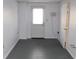 This room features neutral paint, a door to the outside and an interior door at 2335 Corbett Ct, Powder Springs, GA 30127