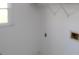 A white room with one window at 2335 Corbett Ct, Powder Springs, GA 30127