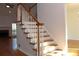 View of the stairs with wood banister and flooring at 2335 Corbett Ct, Powder Springs, GA 30127
