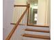 Staircase with wood banister and flooring at 2335 Corbett Ct, Powder Springs, GA 30127