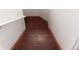 Wooden stairs leading down to another floor, edged with red and a white railing at 2335 Corbett Ct, Powder Springs, GA 30127