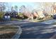 Exterior street view of neighborhood featuring well-maintained homes and mature trees at 2335 Corbett Ct, Powder Springs, GA 30127