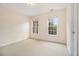 Bedroom featuring plush carpeting, soft natural light from the windows, and neutral walls at 3928 Herron Sw Ln, Atlanta, GA 30349