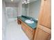 Bathroom featuring a vanity with lots of storage cabinets, green countertop and separate shower at 7364 N Mitchell N Ct, Villa Rica, GA 30180