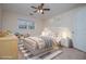 Comfortable staged bedroom with neutral tones and natural light at 7364 N Mitchell N Ct, Villa Rica, GA 30180
