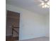 Bright bedroom with a ceiling fan and access to the stairs at 7364 N Mitchell N Ct, Villa Rica, GA 30180