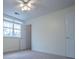 Bedroom featuring a ceiling fan, large window, and carpeted floors at 7364 N Mitchell N Ct, Villa Rica, GA 30180