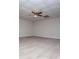 Spacious bedroom with neutral carpeting, ceiling fan and a walk-in closet at 7364 N Mitchell N Ct, Villa Rica, GA 30180