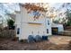 The exterior view showcases a two-story home with a deck, carport, and well-maintained surroundings at 7364 N Mitchell N Ct, Villa Rica, GA 30180