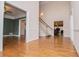 Spacious foyer with hardwood floors and staircase, creating a grand entrance at 7364 N Mitchell N Ct, Villa Rica, GA 30180