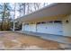 Spacious three-car garage with white doors, ample parking, and a well-lit exterior at 7364 N Mitchell N Ct, Villa Rica, GA 30180