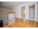 Hallway with hardwood floors leading to rooms with natural light at 7364 N Mitchell N Ct, Villa Rica, GA 30180
