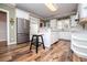 Stylish kitchen features white cabinets, granite countertops, and a bar, great for entertaining at 7364 N Mitchell N Ct, Villa Rica, GA 30180