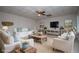Spacious living room with comfortable seating, neutral decor, and stylish accents at 7364 N Mitchell N Ct, Villa Rica, GA 30180