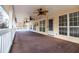 Spacious, covered patio with ceiling fans providing ample room for outdoor living and entertaining at 7364 N Mitchell N Ct, Villa Rica, GA 30180
