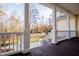 View from the spacious porch with white railings and wooden floor at 7364 N Mitchell N Ct, Villa Rica, GA 30180