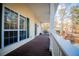 Inviting porch with wood flooring and views of the surrounding neighborhood at 7364 N Mitchell N Ct, Villa Rica, GA 30180