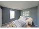 This bedroom features gray walls, neutral carpet, a bright window, and staged furniture at 1946 Taffeta Trl, Lithonia, GA 30058