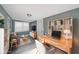 Well-lit home office featuring a spacious desk and built-in bookshelves at 1946 Taffeta Trl, Lithonia, GA 30058