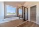 Modern bathroom features a soaking tub, a black framed shower, and a bright window at 215 Pinewood Dr, Covington, GA 30014