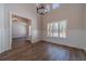 Inviting entryway with wood floors, wainscoting, large windows, and chandelier under a high ceiling at 215 Pinewood Dr, Covington, GA 30014