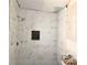 Modern bathroom with tiled shower featuring a rainfall shower head and niche for storage at 2348 Jones Nw Rd, Atlanta, GA 30318