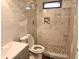 Modern bathroom features a tiled shower with a decorative tile accent and mosaic tile floor at 2348 Jones Nw Rd, Atlanta, GA 30318