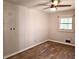 Bedroom featuring hardwood floors, ceiling fan, and a window providing natural light at 2348 Jones Nw Rd, Atlanta, GA 30318