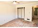 Bedroom with hardwood floors, fresh paint and view of the closet and open doorway at 2348 Jones Nw Rd, Atlanta, GA 30318