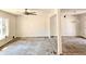 Spacious living room with large windows and ceiling fan providing ample natural light and comfort at 2348 Jones Nw Rd, Atlanta, GA 30318
