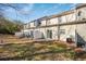 Backyard view of the home featuring sliding glass doors, patio, and fenced area at 2411 Heritage Park Nw Cir # 14, Kennesaw, GA 30144