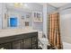 Bathroom with a white countertop sink and vanity, an ornate mirror, and a shower/tub at 2411 Heritage Park Nw Cir # 14, Kennesaw, GA 30144