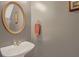 Elegant powder room with a stylish sink, modern fixtures, and neutral wall color at 2411 Heritage Park Nw Cir # 14, Kennesaw, GA 30144