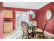 Dining room with a round glass table, ornate chairs, chandelier, and bright natural light at 2411 Heritage Park Nw Cir # 14, Kennesaw, GA 30144