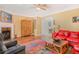 Spacious living room with a fireplace, hardwood floors, and comfortable furnishings at 2411 Heritage Park Nw Cir # 14, Kennesaw, GA 30144
