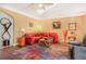Cozy living room featuring hardwood floors, a colorful rug, and comfortable seating at 2411 Heritage Park Nw Cir # 14, Kennesaw, GA 30144