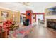 Open-concept living room with hardwood floors, fireplace, and adjoining kitchen at 2411 Heritage Park Nw Cir # 14, Kennesaw, GA 30144