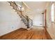 Entryway showcasing hardwood floors, staircase with decorative railing, and neutral decor at 1595 Bakers Glen Dr, Atlanta, GA 30350