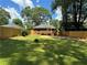 Spacious backyard with new wooden fence, lush lawn, patio, and deck, perfect for outdoor living at 1670 Rogers Sw Ave, Atlanta, GA 30310