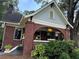 Charming brick home with a lovely arched porch and beautifully landscaped front yard at 1670 Rogers Sw Ave, Atlanta, GA 30310