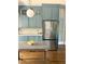 Kitchen featuring sleek stainless steel appliances, custom cabinetry and breakfast bar at 1670 Rogers Sw Ave, Atlanta, GA 30310