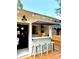 Stylish outdoor bar area with awning, counter seating, and easy access to the interior at 1670 Rogers Sw Ave, Atlanta, GA 30310