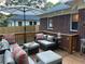 Comfortable outdoor patio seating area with stylish cushions and umbrella for shade at 1670 Rogers Sw Ave, Atlanta, GA 30310