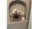A decorative wall niche with a white orchid and candle adds a touch of elegance to the interior at 1670 Rogers Sw Ave, Atlanta, GA 30310